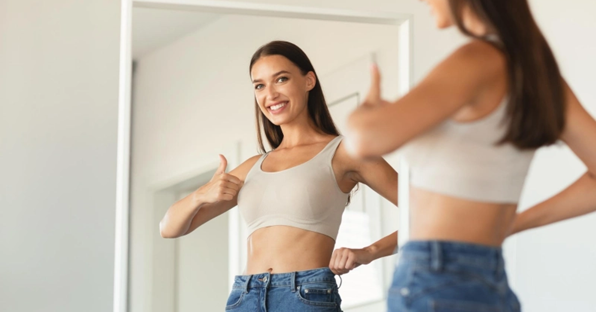 A confident woman after completing a weight loss program