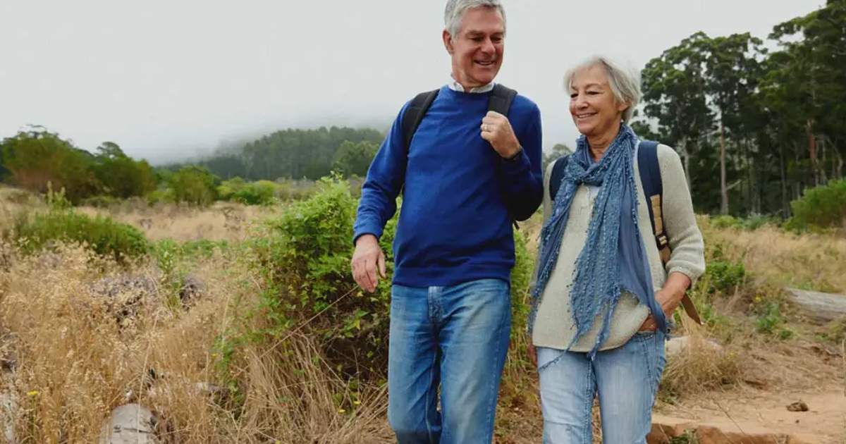 a senior citizen with a healthy weight hiking in the nature