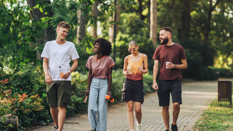 A group of friends taking a walk in the park