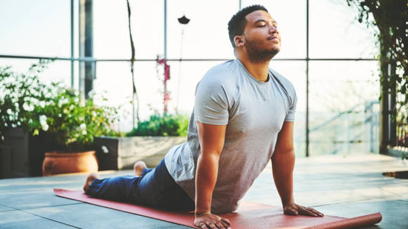 a slightly overweight man stretching in the morning